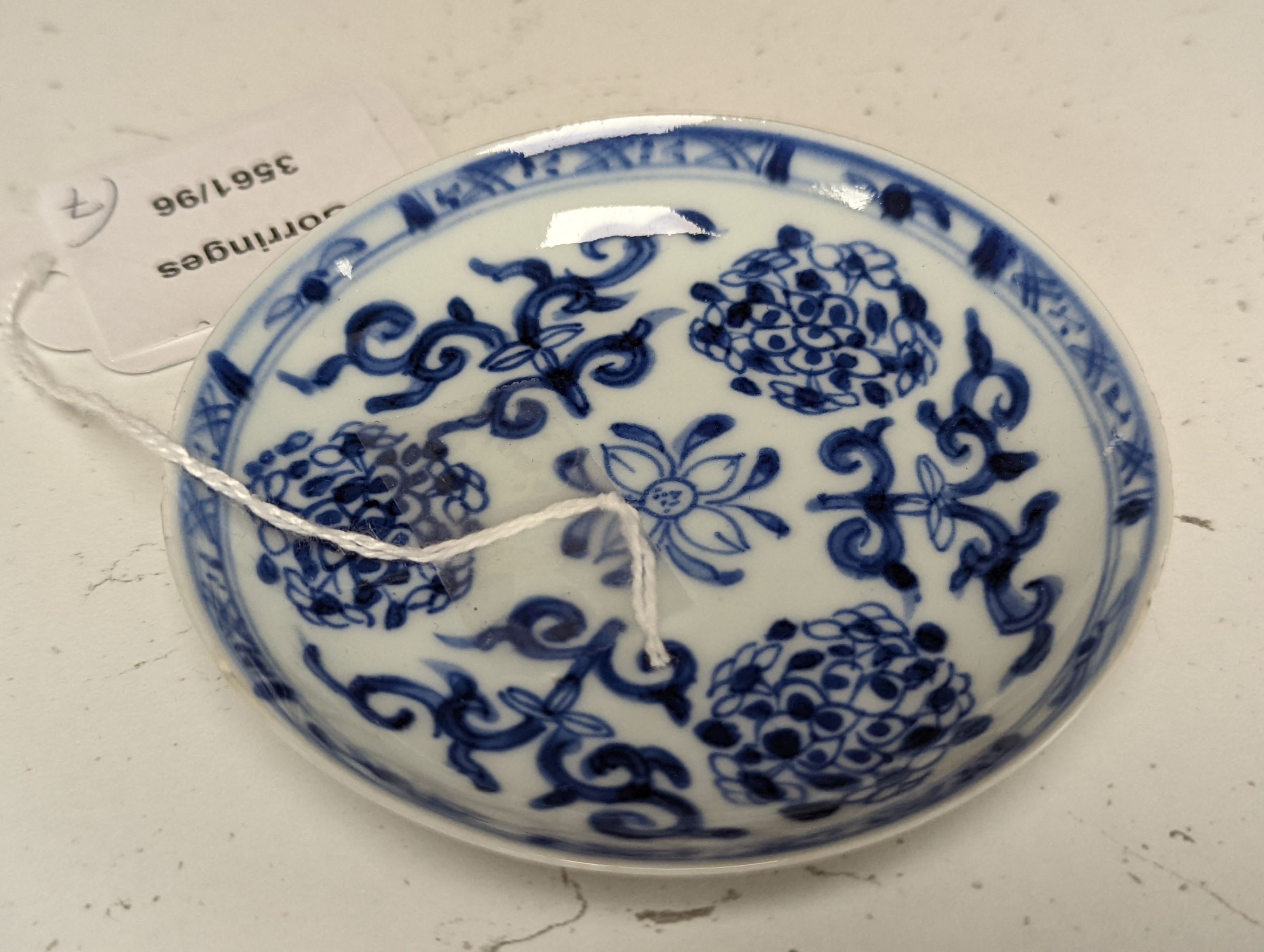Seven 18th century Chinese saucer dishes, largest 14 cms diameter.